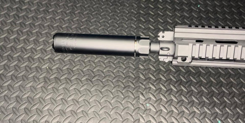 Black metal suppressor accessory for gel blaster with realistic tactical design