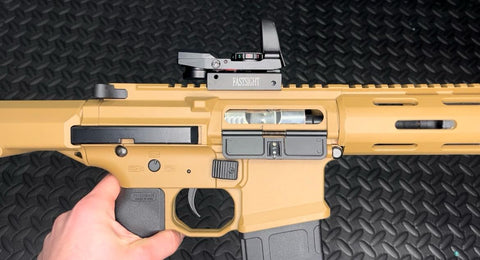 Compact holographic sight with anti-glare lens and laser targeting system